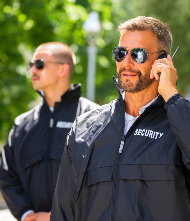 a security man calling using his cellphone