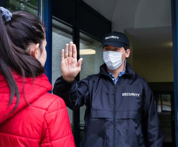 security guard stopping woman